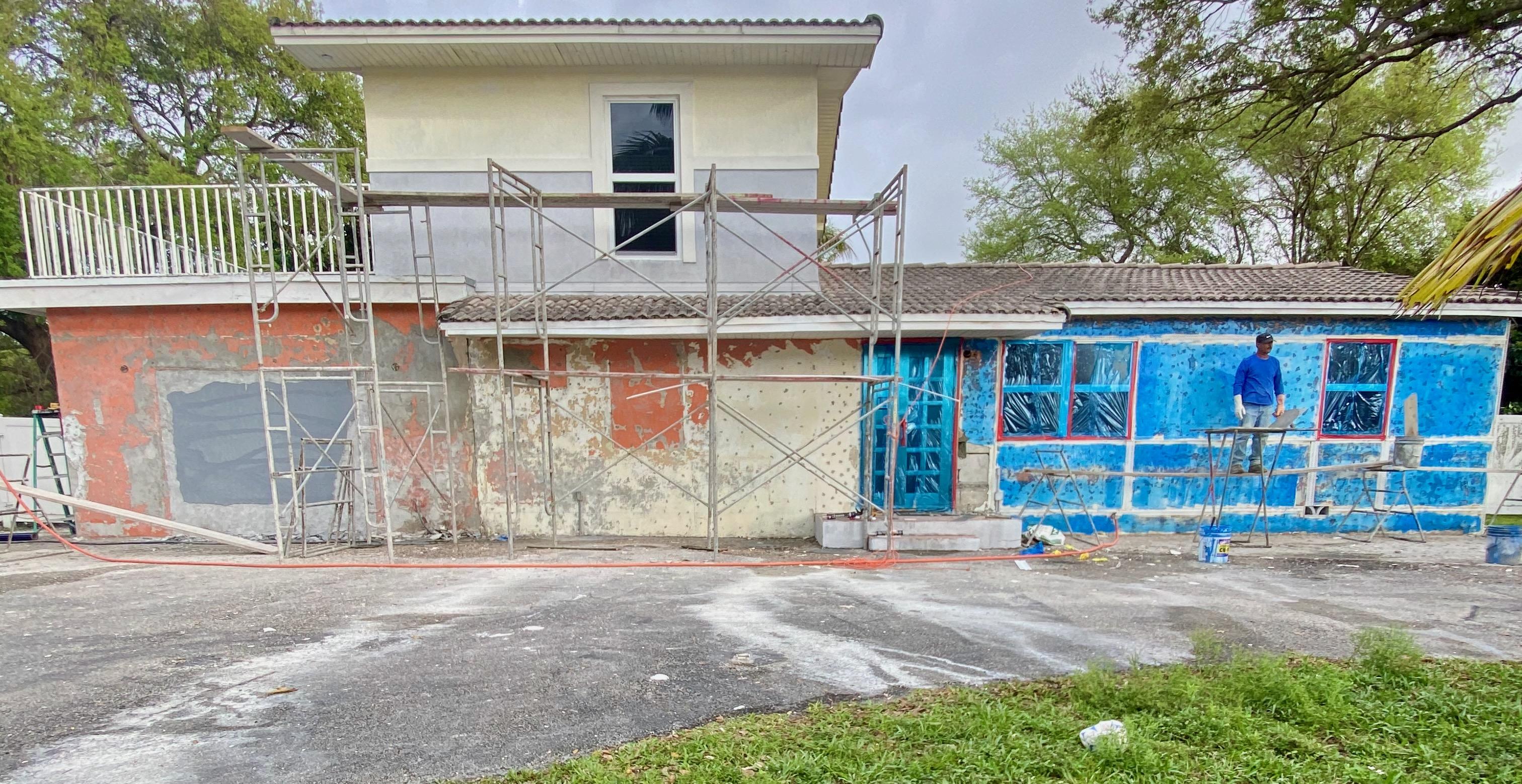 Water damage on exterior stucco surface